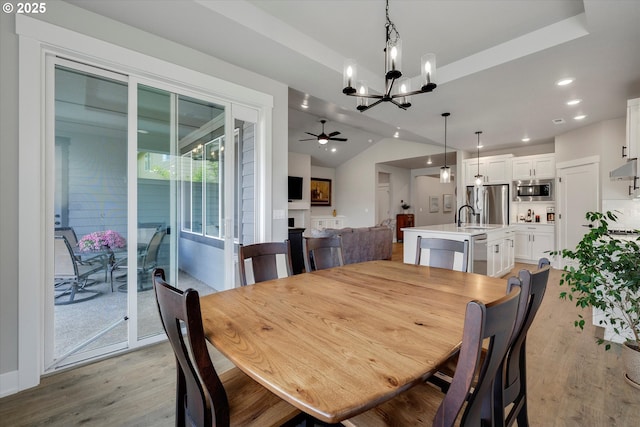 1332 SE 14th Ave, Canby, OR 97013 - dining room with a chandelier, light wood-style floors, vaulted ceiling, recessed lighting, and a ceiling fan