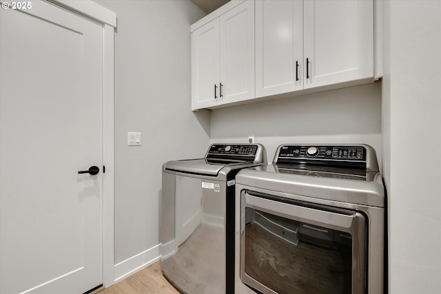 1332 SE 14th Ave, Canby, OR 97013 - laundry area with cabinet space, independent washer and dryer, baseboards, and light wood finished floors