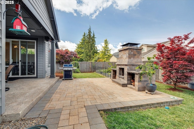 1332 SE 14th Ave, Canby, OR 97013 - view of patio / terrace with an outdoor stone fireplace, a grill, and fence