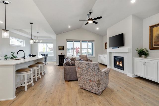 1332 SE 14th Ave, Canby, OR 97013 - living room with a fireplace, light wood-style floors, ceiling fan, lofted ceiling, and recessed lighting