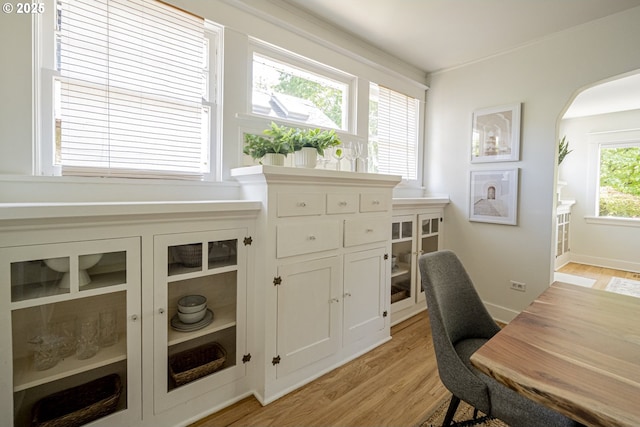 2814 NE 34th Ave, Portland, OR 97212 - office area with light wood-style flooring and arched walkways