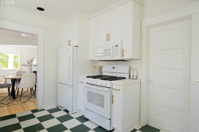 2814 NE 34th Ave, Portland, OR 97212 - kitchen featuring white appliances, light flooring, white cabinets, tasteful backsplash, and ornamental molding