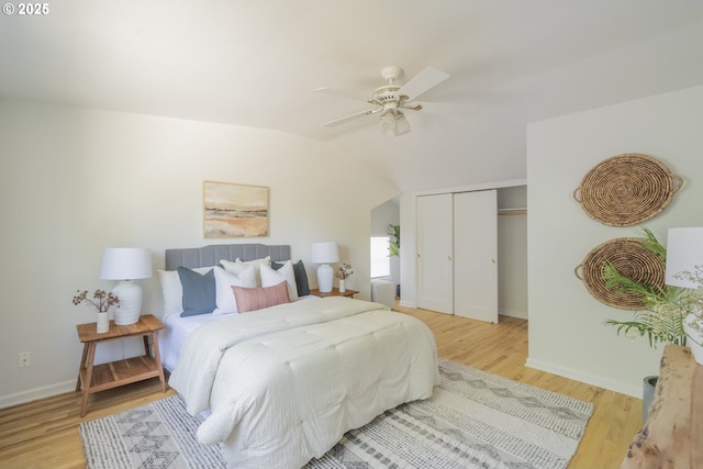 2814 NE 34th Ave, Portland, OR 97212 - bedroom featuring a closet, wood finished floors, baseboards, lofted ceiling, and a ceiling fan