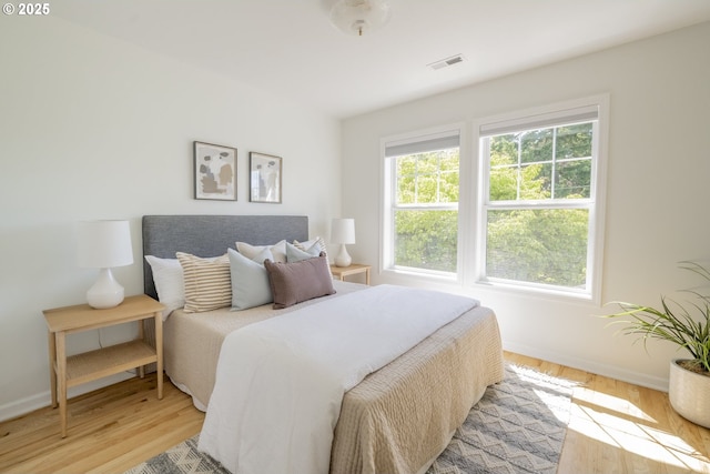 2814 NE 34th Ave, Portland, OR 97212 - bedroom featuring baseboards and light wood finished floors