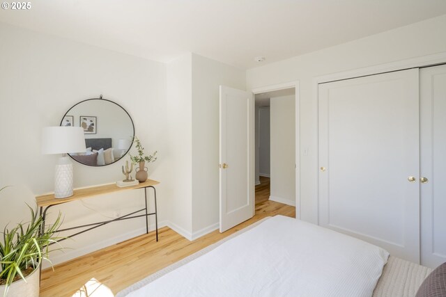 2814 NE 34th Ave, Portland, OR 97212 - bedroom featuring wood finished floors, a closet, and baseboards