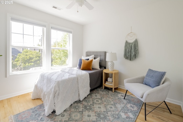 2814 NE 34th Ave, Portland, OR 97212 - bedroom with light wood-style flooring, baseboards, and a ceiling fan