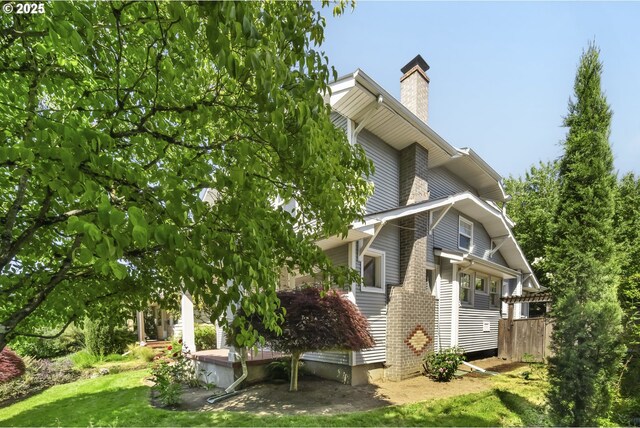 2814 NE 34th Ave, Portland, OR 97212 - view of side of home featuring a chimney