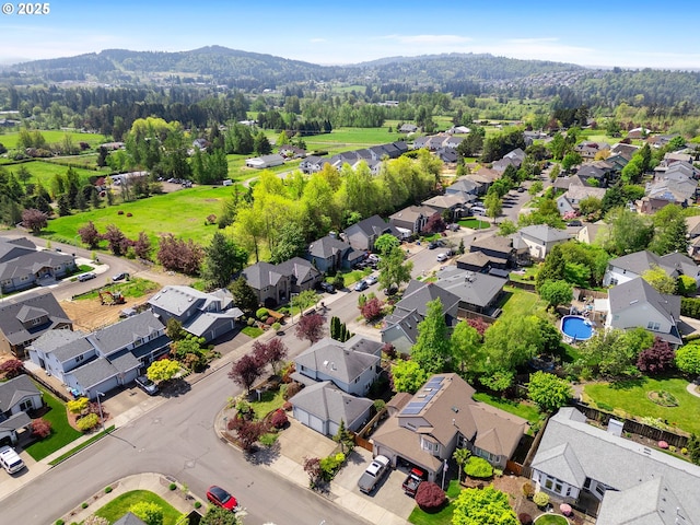 aerial view featuring a mountain view and a residential view
