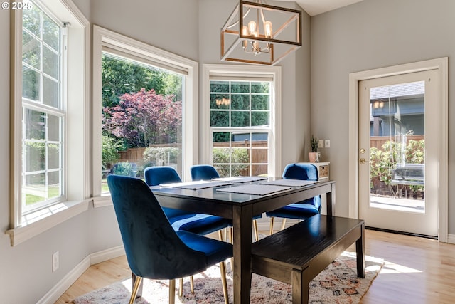 4675 Symphony Dr, Eugene, OR 97404 - dining area featuring a chandelier and light wood-style flooring