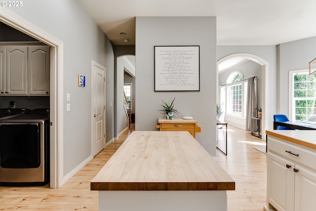 4675 Symphony Dr, Eugene, OR 97404 - kitchen featuring wooden counters, arched walkways, and light wood-style flooring