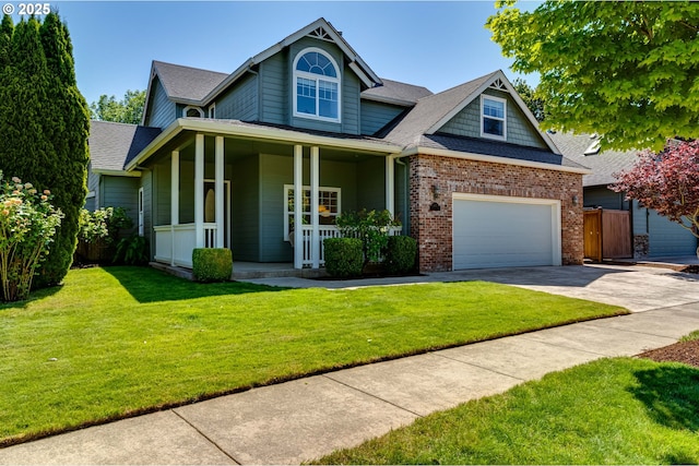 4675 Symphony Dr, Eugene, OR 97404 - view of front facade with a porch, driveway, a garage, brick siding, and a shingled roof
