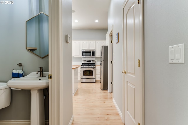 4675 Symphony Dr, Eugene, OR 97404 - hall with light wood-style flooring and recessed lighting