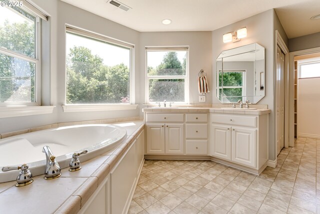 4675 Symphony Dr, Eugene, OR 97404 - full bath featuring double vanity, healthy amount of natural light, a bath, and recessed lighting