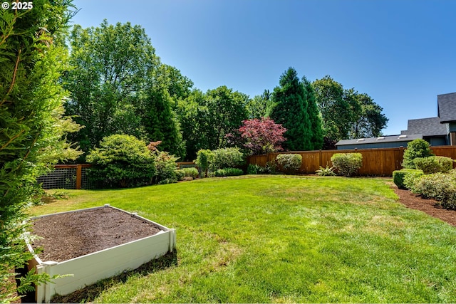 4675 Symphony Dr, Eugene, OR 97404 - fenced backyard with a vegetable garden