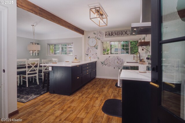 8510 SW Cedarcrest St, Portland, OR 97223 - kitchen featuring a chandelier, wood finished floors, plenty of natural light, a sink, and beam ceiling