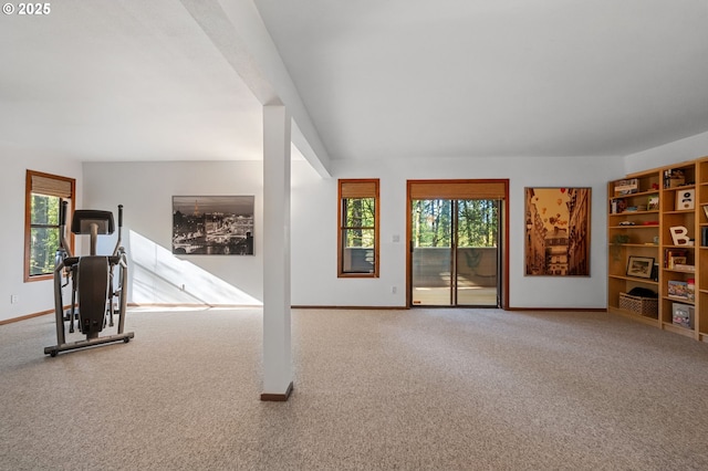 interior space with baseboards and carpet flooring