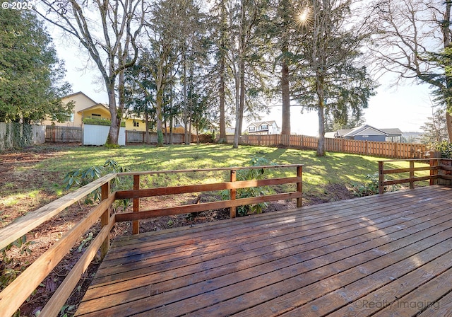 deck featuring a fenced backyard and a yard