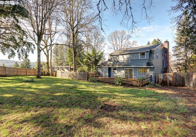 view of yard featuring a fenced backyard and a deck