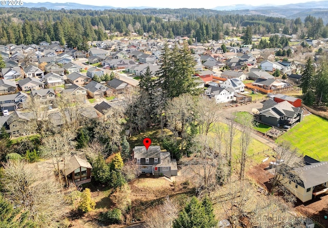 birds eye view of property featuring a residential view and a view of trees