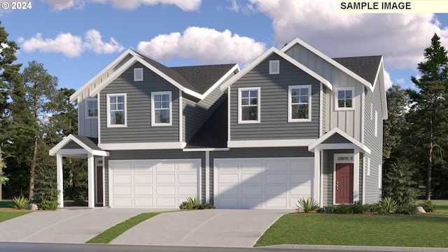 view of front facade with a garage and a front yard