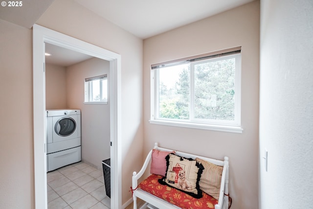 washroom featuring washer / clothes dryer and light tile patterned floors