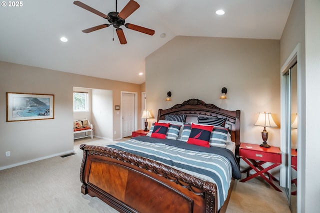 bedroom with ceiling fan, lofted ceiling, and light carpet