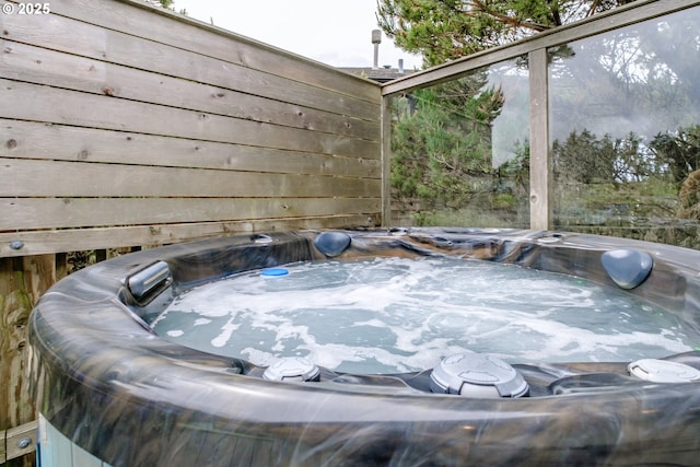 exterior details featuring a hot tub