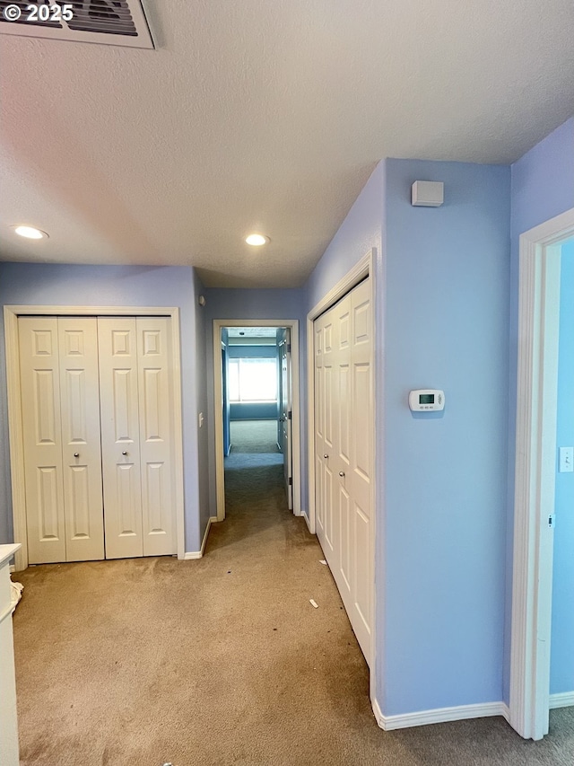 6230 SW Zabaco Ter, Beaverton, OR 97078 - corridor featuring light colored carpet, recessed lighting, baseboards, and a textured ceiling