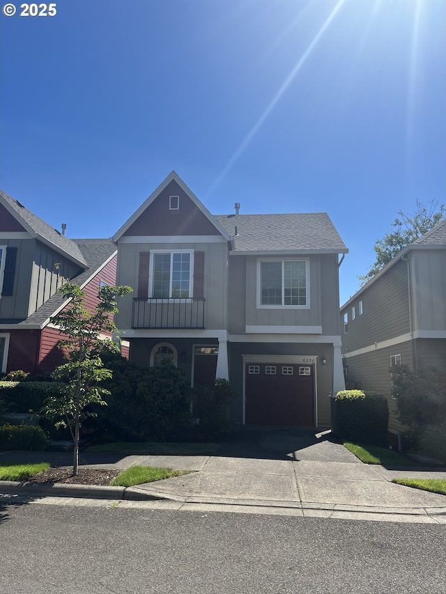 6230 SW Zabaco Ter, Beaverton, OR 97078 - view of front of home featuring a garage, driveway, stucco siding, and a shingled roof