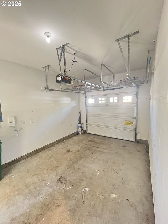 6230 SW Zabaco Ter, Beaverton, OR 97078 - garage featuring a garage door opener and baseboards