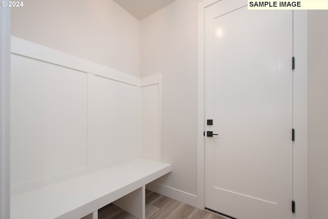 mudroom with light hardwood / wood-style floors