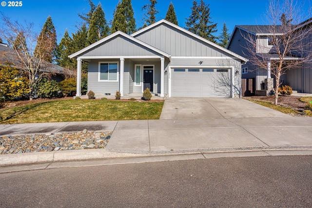 view of front of home featuring a garage, driveway, crawl space, board and batten siding, and a front yard