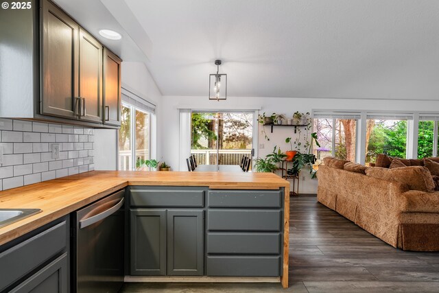 kitchen featuring dishwasher, decorative light fixtures, butcher block counters, decorative backsplash, and gray cabinets