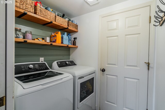 laundry room with washer and dryer