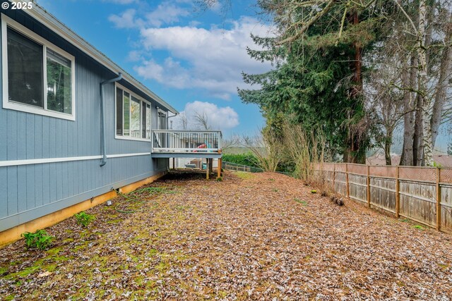 view of yard featuring a wooden deck