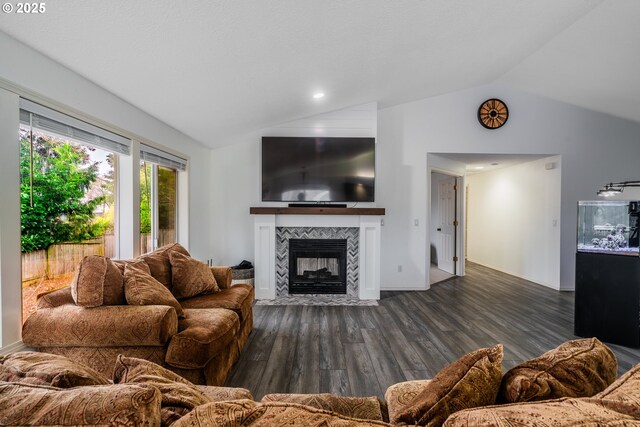 living room featuring vaulted ceiling, a high end fireplace, and dark hardwood / wood-style floors