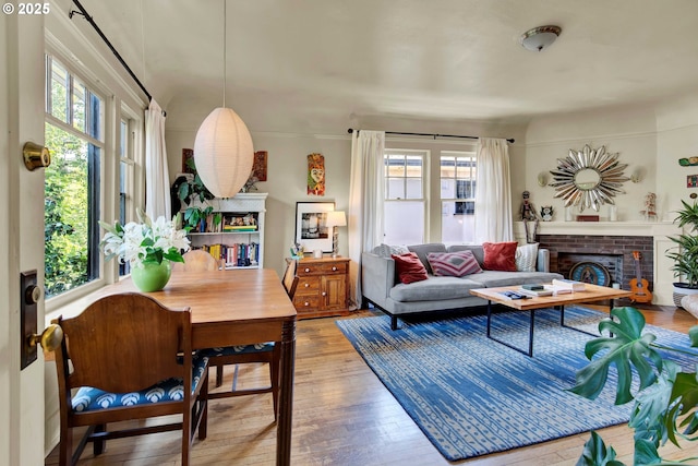 2066 NW Overton St, Portland, OR 97209 - living area featuring plenty of natural light, hardwood / wood-style floors, and a fireplace