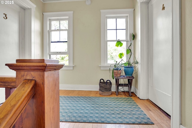 2066 NW Overton St, Portland, OR 97209 - foyer with light wood-style flooring and baseboards