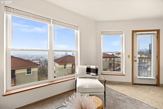 413 NW Uptown Ter Unit 2A, Portland, OR 97210 - sitting room with healthy amount of natural light, carpet flooring, and baseboards
