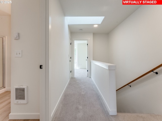 4578 NE Nicholson Loop, Vancouver, WA 98661 - corridor with an upstairs landing, a skylight, heating unit, baseboards, and recessed lighting