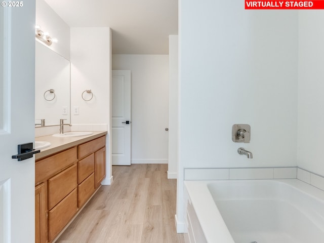 4578 NE Nicholson Loop, Vancouver, WA 98661 - full bath with wood finished floors, a tub, and double vanity