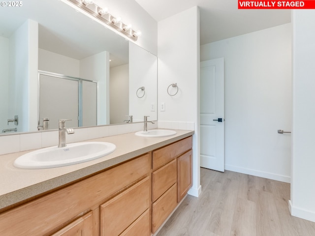 4578 NE Nicholson Loop, Vancouver, WA 98661 - full bath with wood finished floors, a stall shower, double vanity, and baseboards