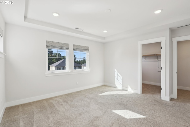 18315 SW Silvertip St, Beaverton, OR 97007 - unfurnished bedroom with carpet floors, a walk in closet, recessed lighting, a raised ceiling, and baseboards