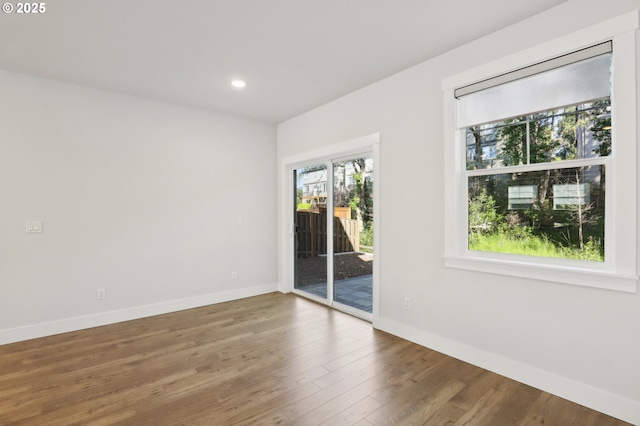 18315 SW Silvertip St, Beaverton, OR 97007 - empty room featuring baseboards, wood finished floors, and recessed lighting