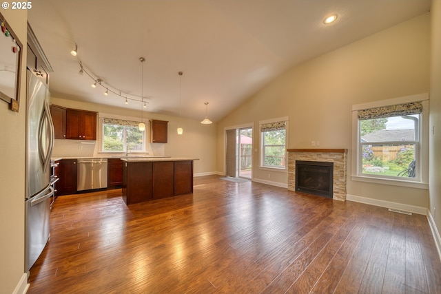 2639 Sykes Rd, Saint Helens, OR 97051 - kitchen with appliances with stainless steel finishes, open floor plan, dark wood-style flooring, light countertops, and baseboards