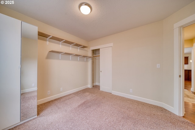 2639 Sykes Rd, Saint Helens, OR 97051 - unfurnished bedroom with carpet flooring, baseboards, a closet, and a textured ceiling