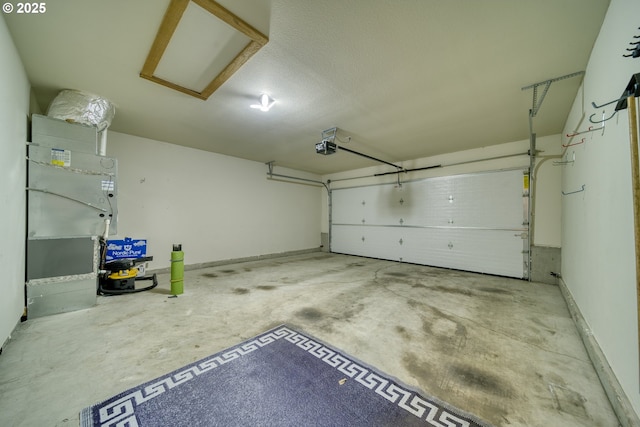 2639 Sykes Rd, Saint Helens, OR 97051 - garage featuring a garage door opener and baseboards