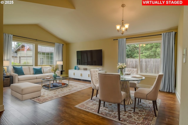 2639 Sykes Rd, Saint Helens, OR 97051 - dining room with plenty of natural light, lofted ceiling, wood finished floors, a chandelier, and baseboards