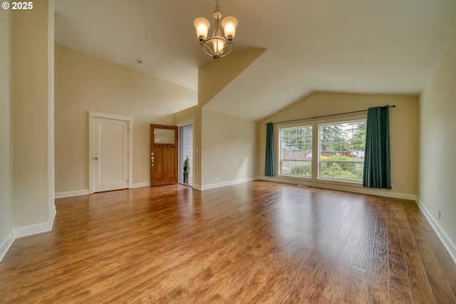 2639 Sykes Rd, Saint Helens, OR 97051 - unfurnished living room featuring a chandelier, wood finished floors, lofted ceiling, and baseboards