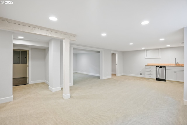 basement with light carpet and sink